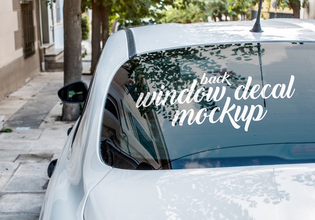 Download Premium Psd Window Decal Mockup On The Back Window Of A White Sedan Car