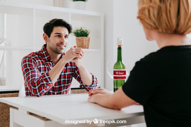 Wine mockup with couple at table PSD Template