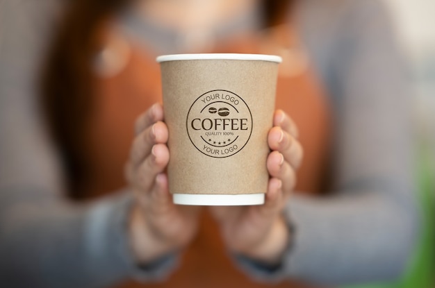 Free Psd Woman Holding Paper Coffee Cup Mockup