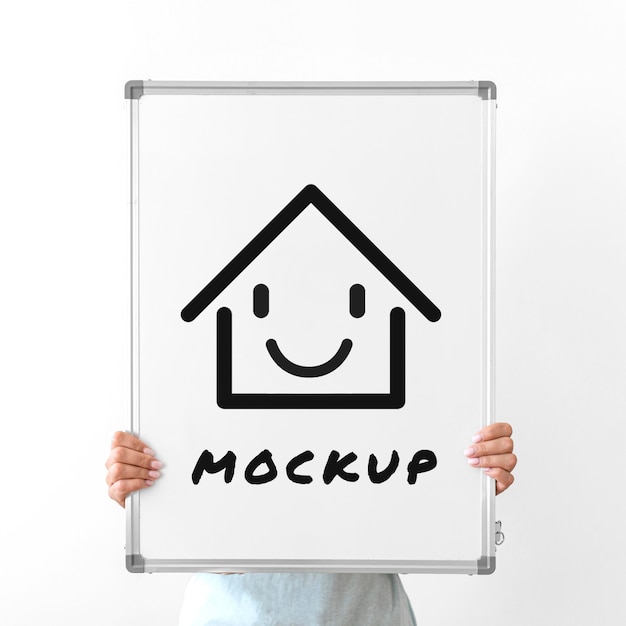 Free PSD | Woman holding up whiteboard mock-up