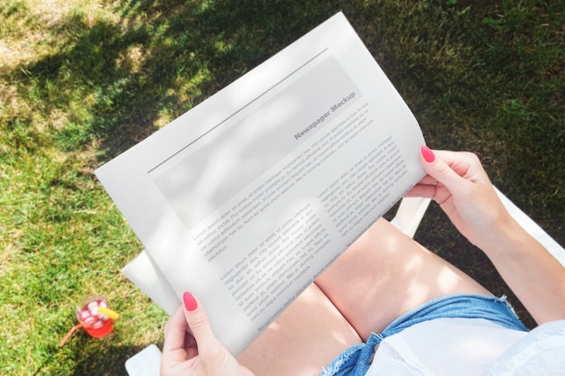 Download Premium PSD | Woman reading newspaper in backyard mockup
