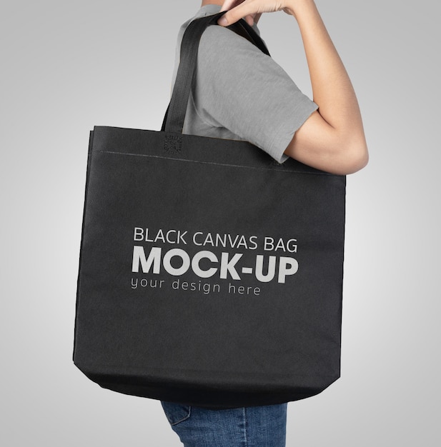Download Premium PSD | Woman with black tote shopping bags mock-up