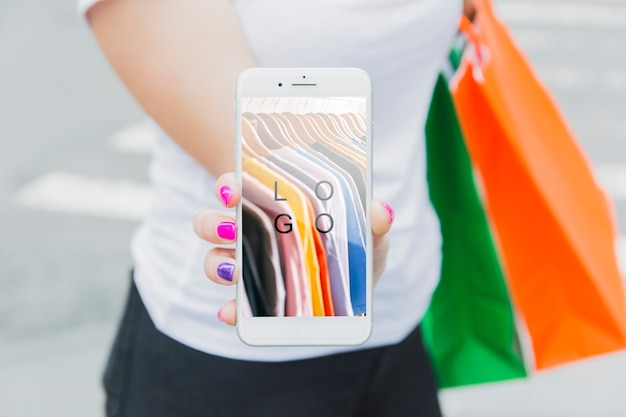 Download Woman with smartphone mockup and shopping bags PSD file ...