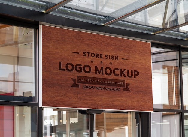 Download Premium PSD | Wood sign on shop front window mockup