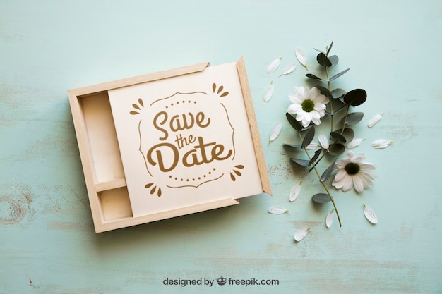 Wooden box mockup next to flowers PSD file | Free Download