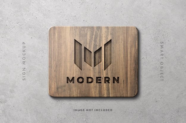 Wooden sign logo mockup on concrete wall Premium Psd