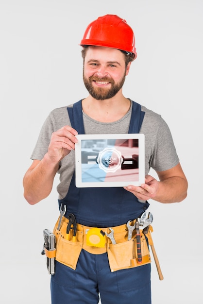 Download Worker holding tablet mockup for labor day PSD file | Free Download