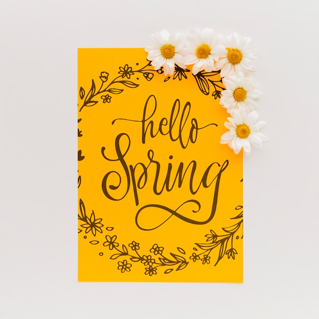 Download Yellow paper mockup with spring flowers | Free PSD File