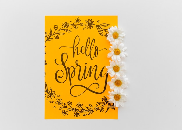 Download Yellow paper mockup with spring flowers | Free PSD File