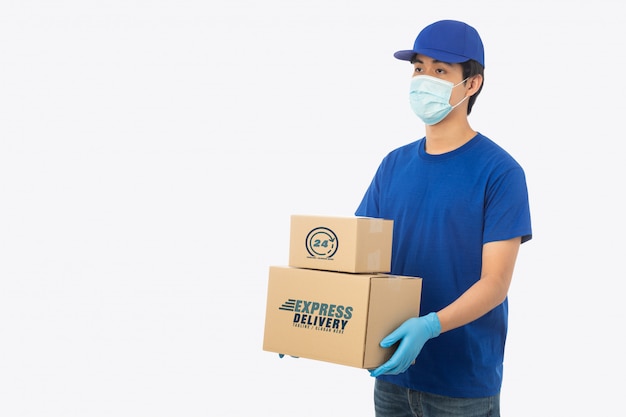 Download Young delivery man holding paper cardboard box mockup ...