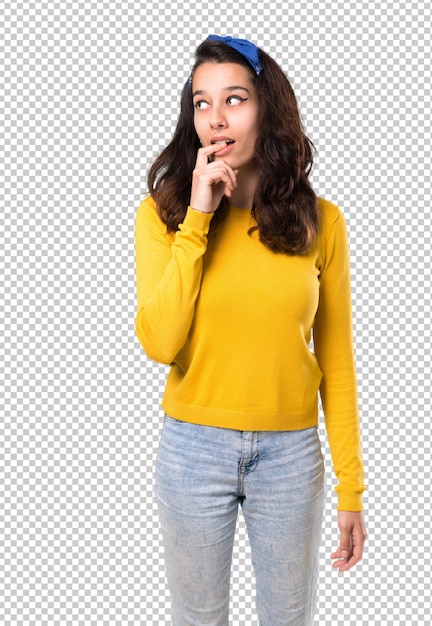 Download Young girl with yellow sweater and blue bandana on her ...