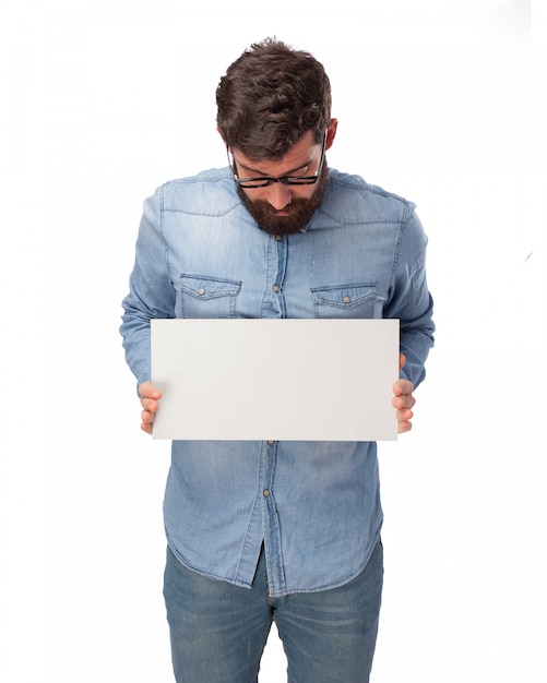 Young Man Holding A Blank Poster Free Psd File