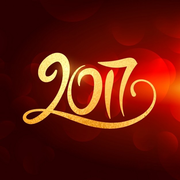 2017 new year lettering in gold color on red\
background