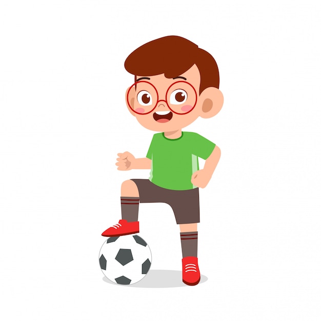 かわいい子供の少年はストライカーとしてサッカーをする プレミアムベクター