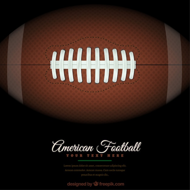 American football background with ball on the
green field