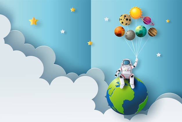  The astronaut is sitting on earth holding planet balloons, paper cut style.