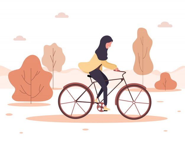 秋の背景 ヒジャーブで漫画のアラブの女性が公園で自転車に乗る 健康的な生活様式 エコ交通 フラットスタイルのモダンなイラスト プレミアムベクター