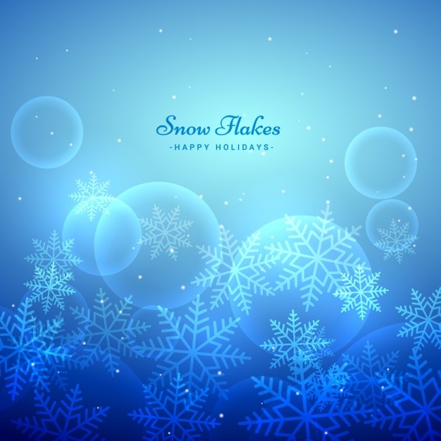 Blue and bokeh background with snow\
flakes