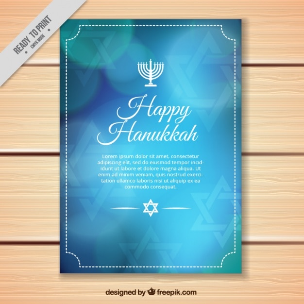 Blue hanukkah greeting card with bokeh\
effect