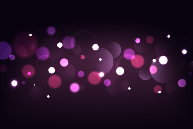 Bokeh lights effect on dark background Free Vector