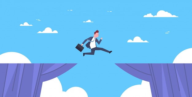 Brave business man jump over cliff gap business to success risk and danger concept Premium Vector