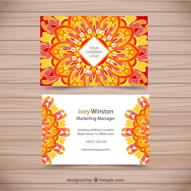 Business card with orange and yellow\
mandala