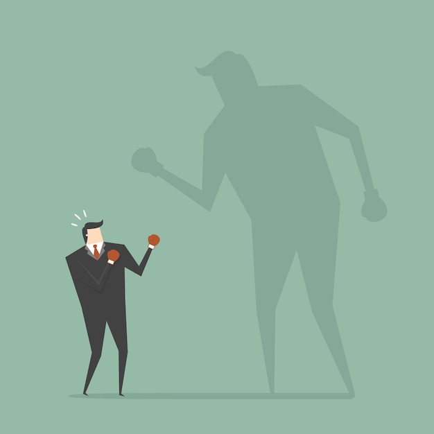 Businessman boxing with a shadow Free Vector Confident Attitude