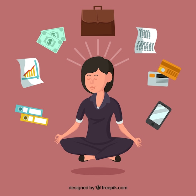 Businesswoman meditating surrounded by
objects