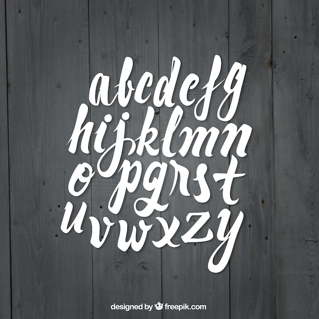 Download Calligraphy font on wood background | Free Vector