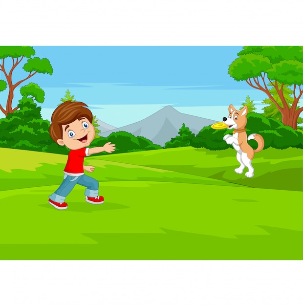 公園で彼の犬とフリスビーをしている漫画少年 プレミアムベクター