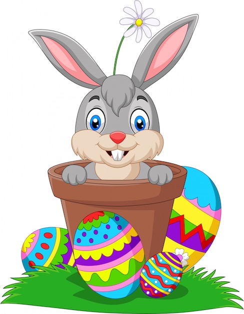 Cartoon Bunny In The Pot With Easter Eggs On The Grass Premium Vector