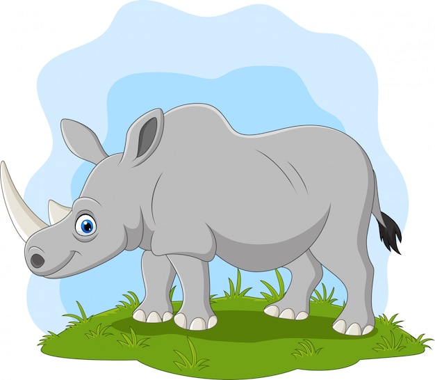 Premium Vector | Cartoon happy rhino on the grass