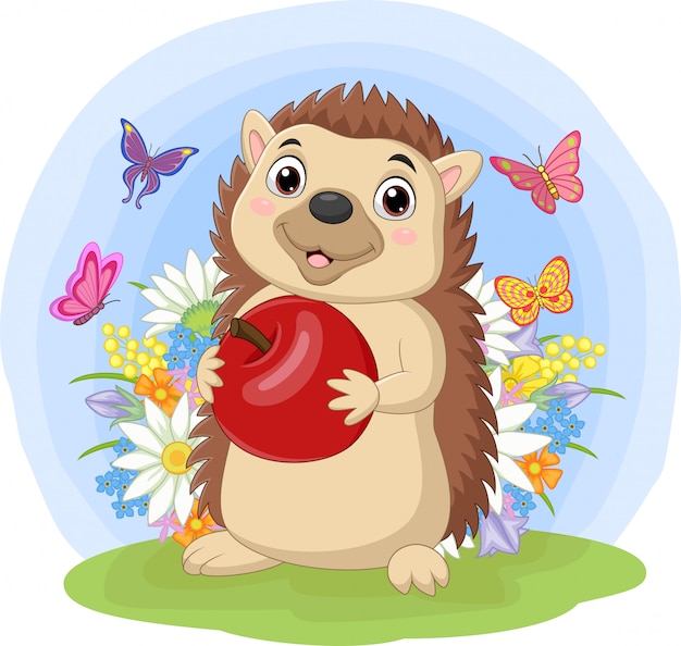 Cartoon hedgehog holding apple in the grass Premium Vector