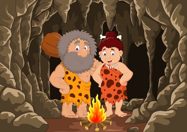 Cartoon prehistoric caveman couple with cave background | Premium ...