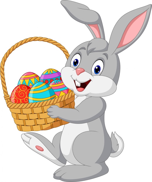 Cartoon rabbit holding an easter basket | Premium Vector