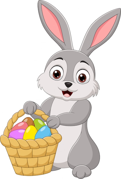 Premium Vector | Cartoon rabbit holding an easter basket