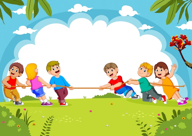 Children play tug of war in the park 