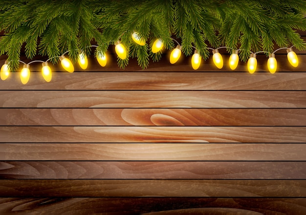 Premium Vector | Christmas wooden background with branches and a garland.