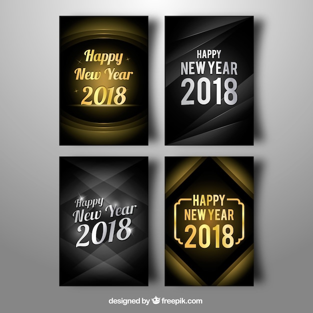 Collection of four silver and golden new year cards Vector | Free Download