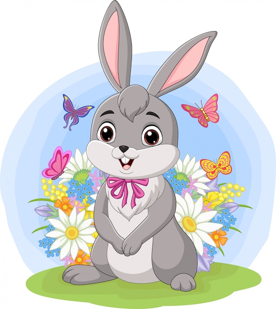 Download Cute baby rabbit standing in the grass | Premium Vector