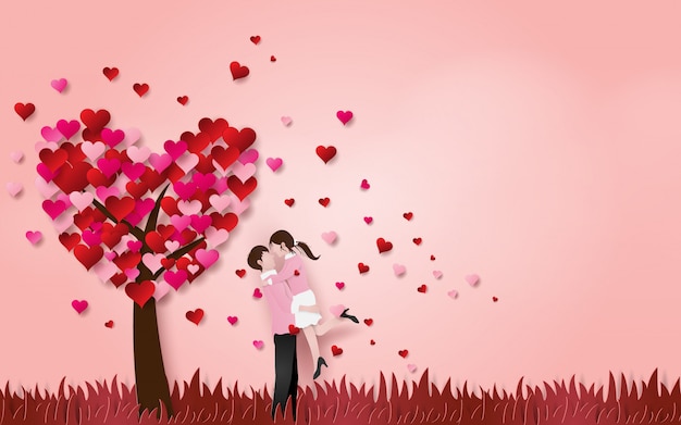 Cute couple hug each other on grass floor with heart tree Premium Vector