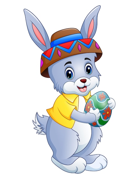 Premium Vector Cute Rabbit Cartoon Holding Easter Egg 