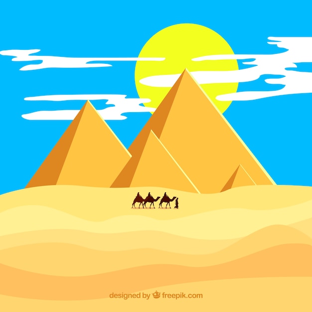 Desert landscape with pyramids and
caravan
