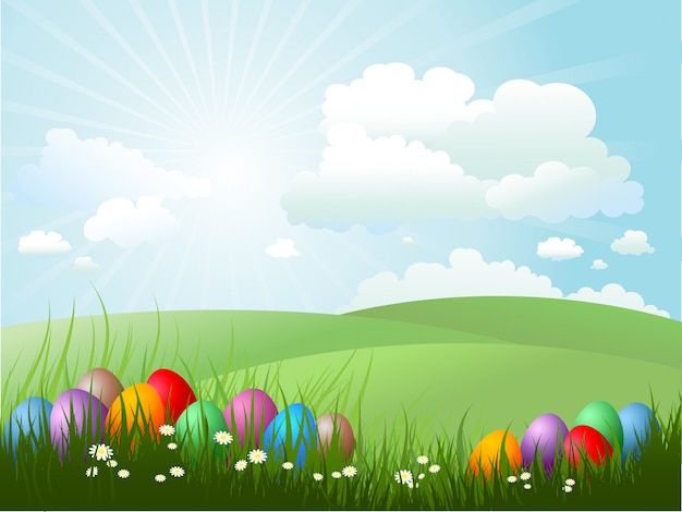 Easter eggs in grass on a sunny day | Free Vector