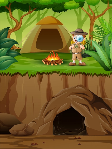 Premium Vector | The explorer boy near his tent