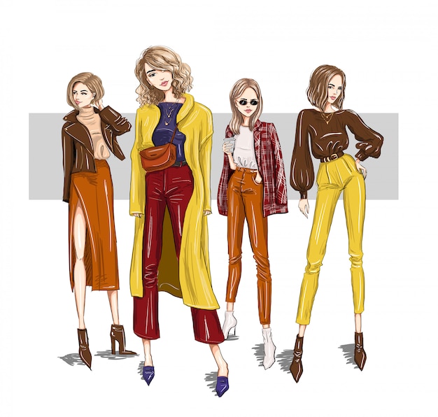 Four bright girls models in trendy outfits Premium Vector