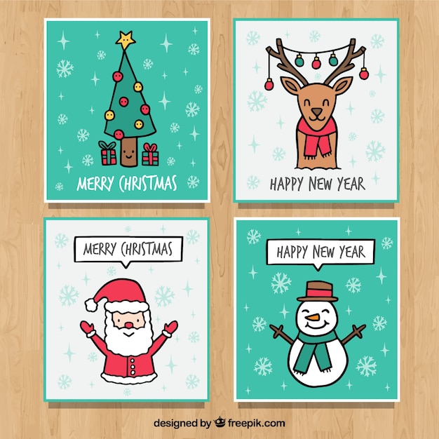 Four hand drawn greeting cards for christmas Vector | Free Download