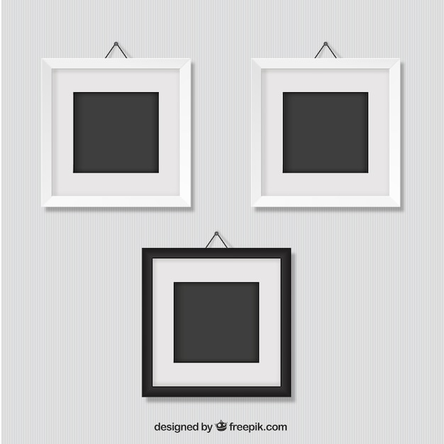 Frames hanging on wall | Free Vector