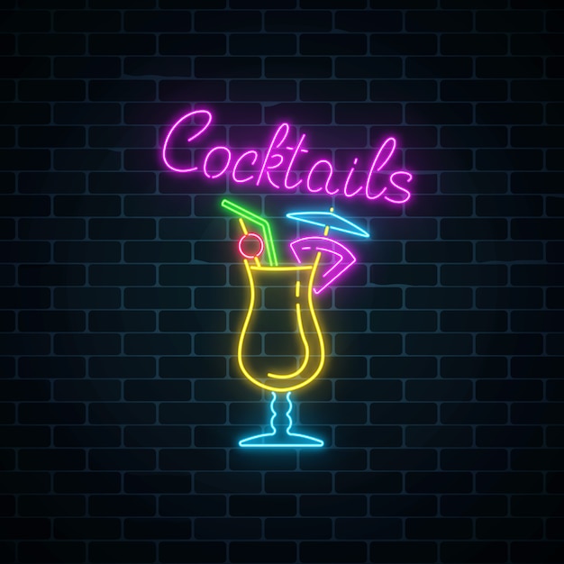 Premium Vector | Glow neon sign of cocktails bar on dark brick wall