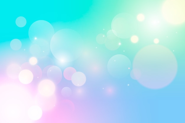 Gradient background with bokeh effect Free Vector